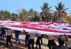 Semangat Nasionalisme di Pantai Keburuan, Merah Putih 1.001 Meter Terbentang