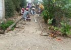 Hibah Semen Memperluas Jalan Rigid Beton di Pedesaan