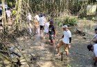 Jaga Keseimbangan Alam, Ratusan Umat Buddha Aksi Bersih Pantai dan Tanam Bakau